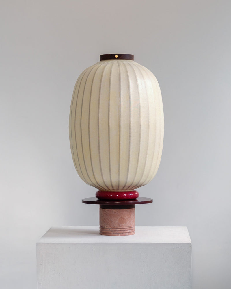 Lotus Charm table lamp with pleated white shade on ceramic base