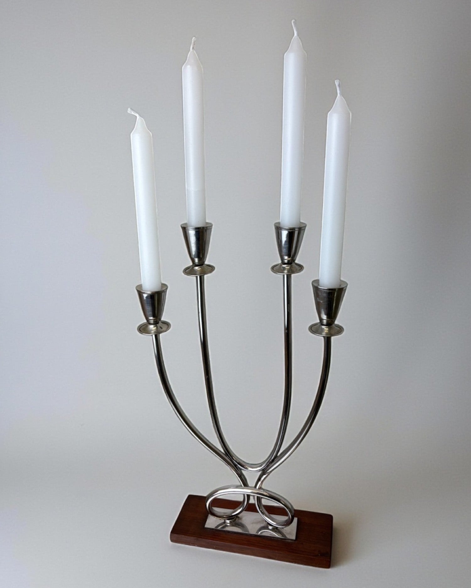 Art deco candlestick in stainless steel and rosewood, 4 flames, Spain, 1970's by Malamar Studio | The Oblist