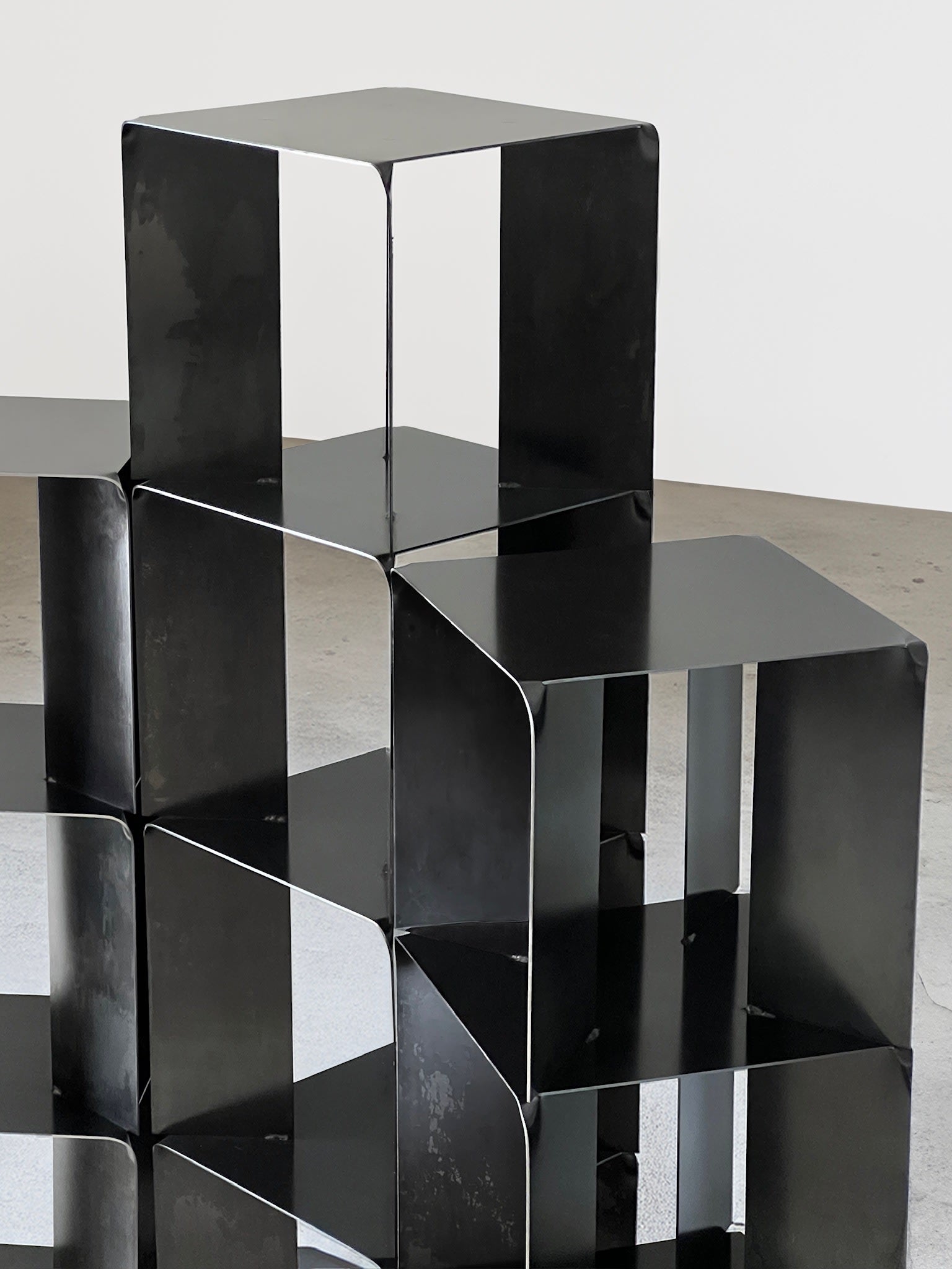 TOMO Shelves — side angle of black metal shelving unit