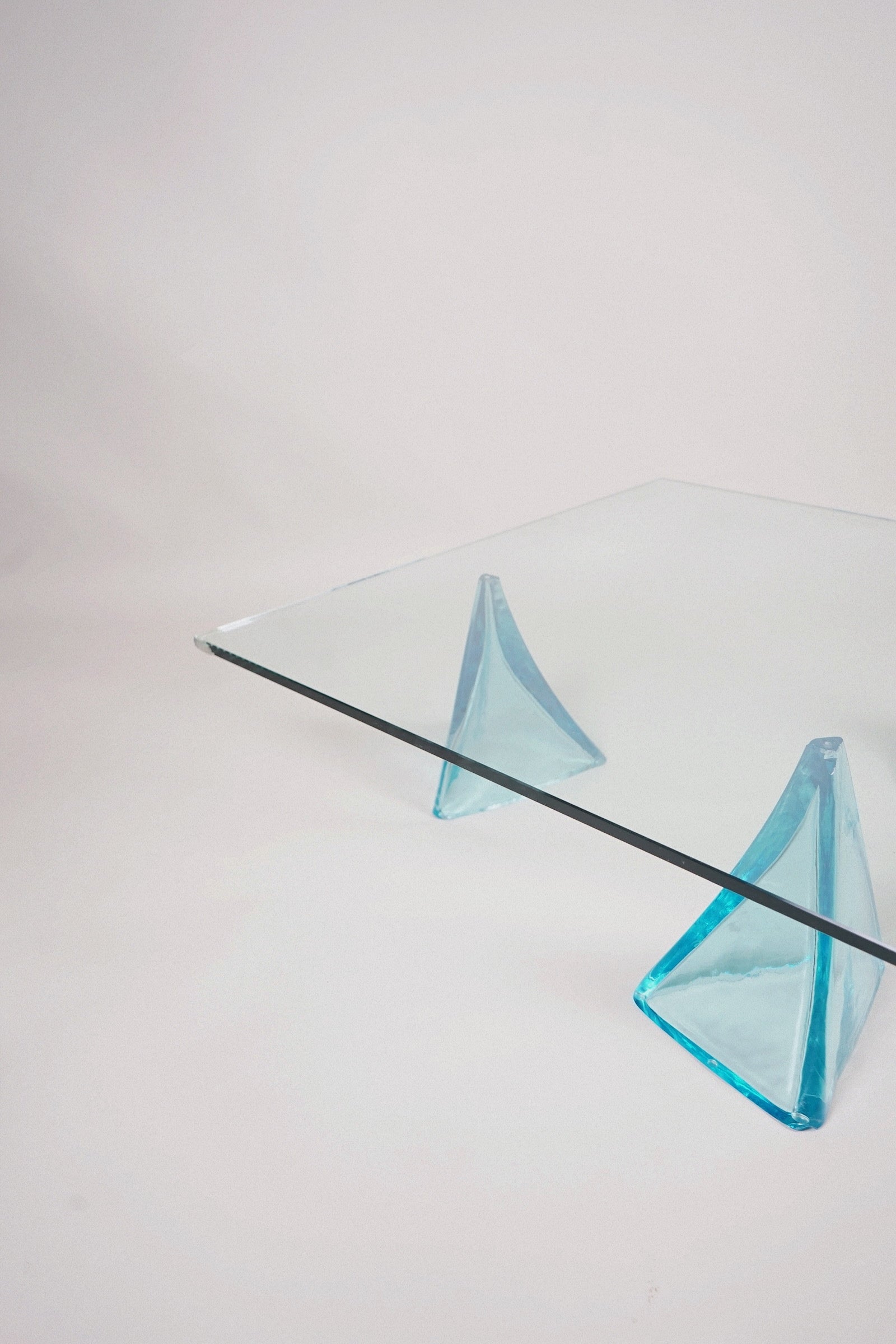 Glass Coffee Table with Sculptural Blue Glass Supports, c.1980s–1990s — close-up of blue glass supports
