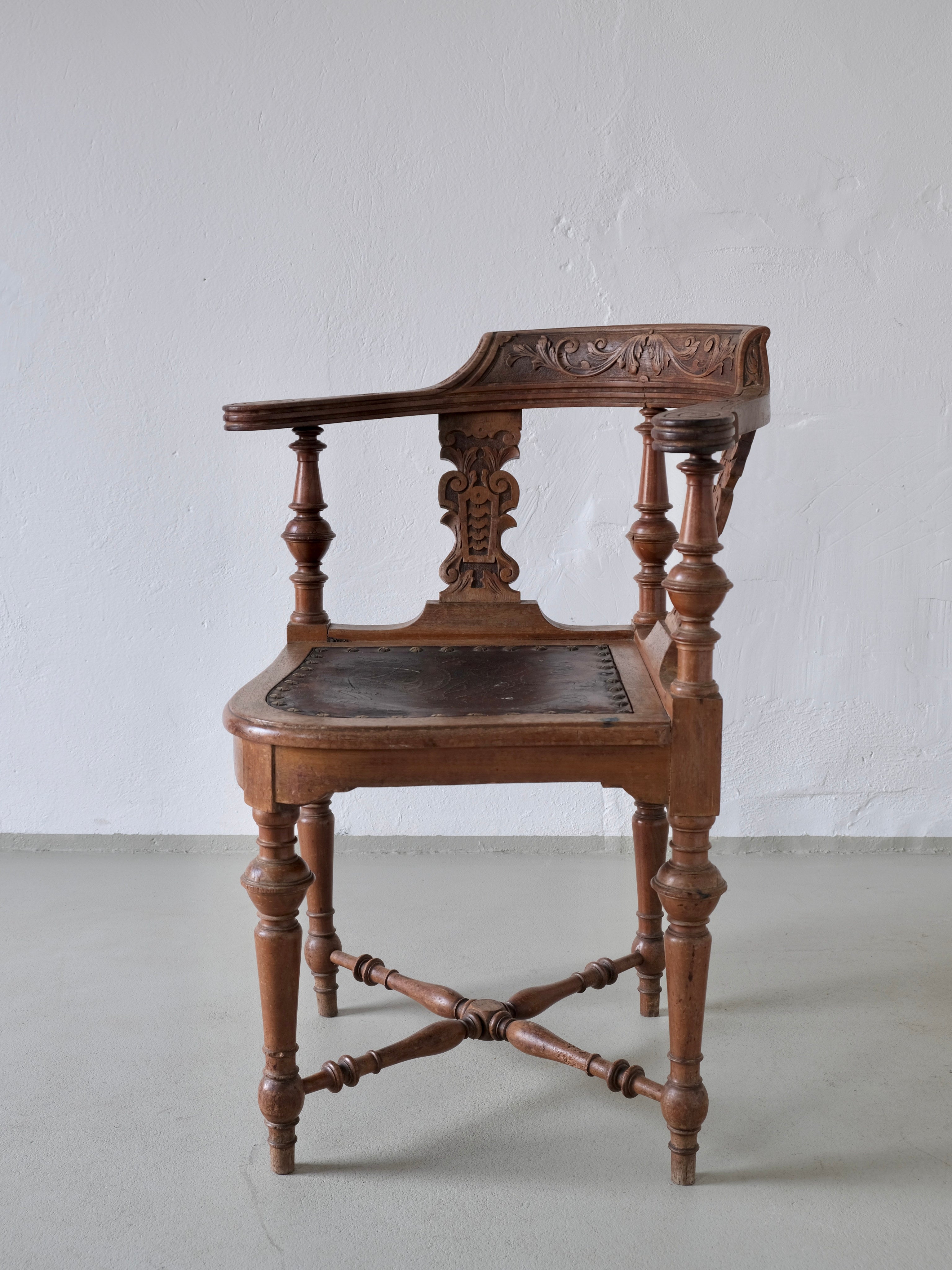 Antique Carved Corner Chair with Leather Seat