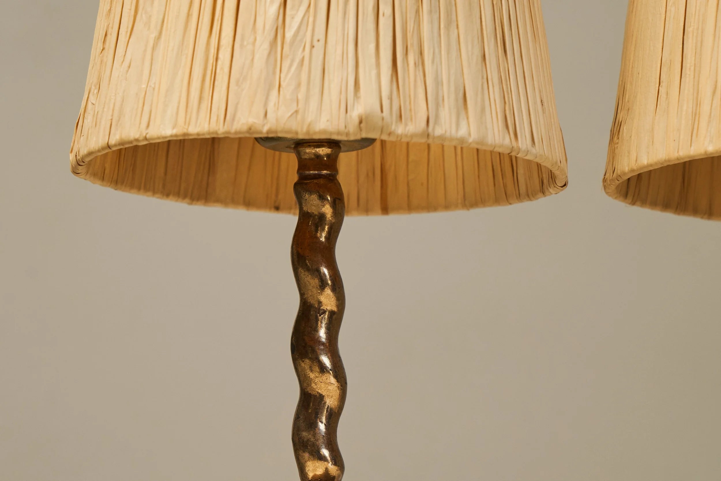 Wonderful Pair of Tripod Table Lamps in Patinated Sand Cast Brass with Raffia Shades — side angle
