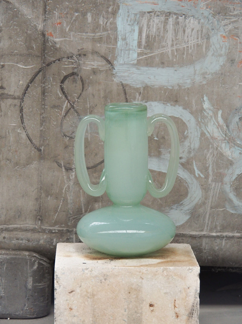 The Vase 02 — close-up of frosted green glass with handles