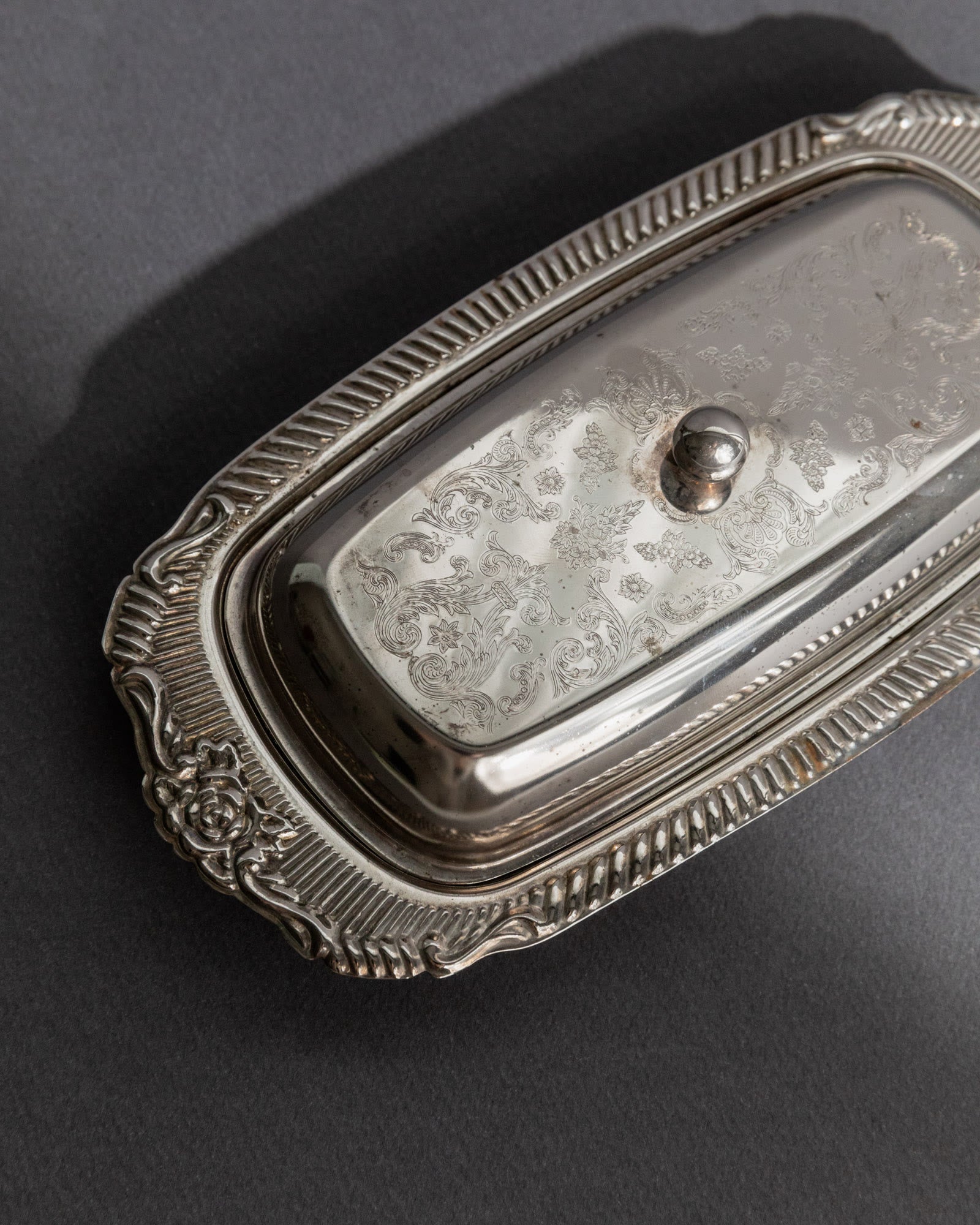 Previous slide Next slide Vintage 1970s Silver Plated Butter Dish, Engraved Ornamental — top view highlighting intricate engr