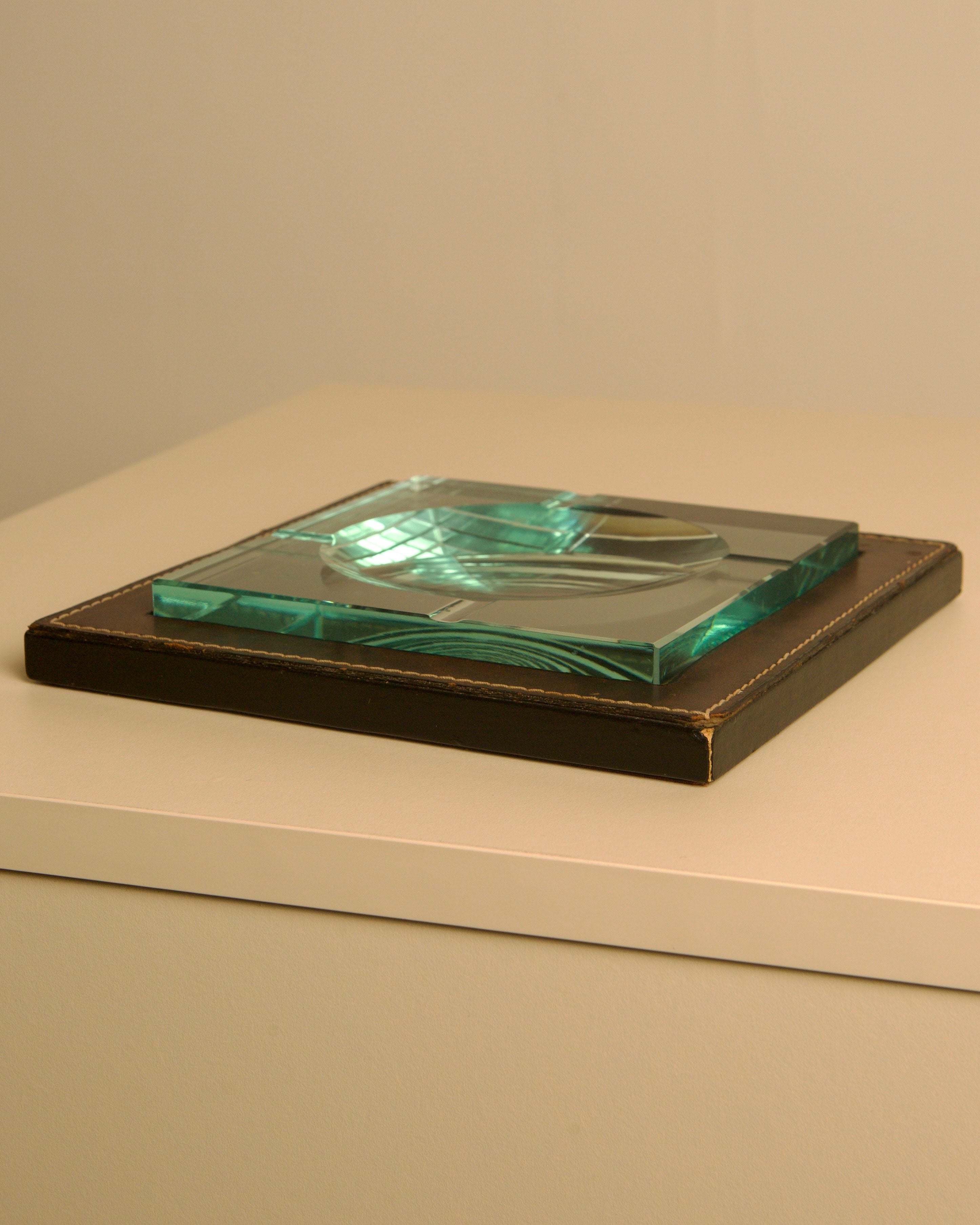 Square Italian Ashtray in Leather and Wood by Fontana Arte, 1960s — angled view on white surface