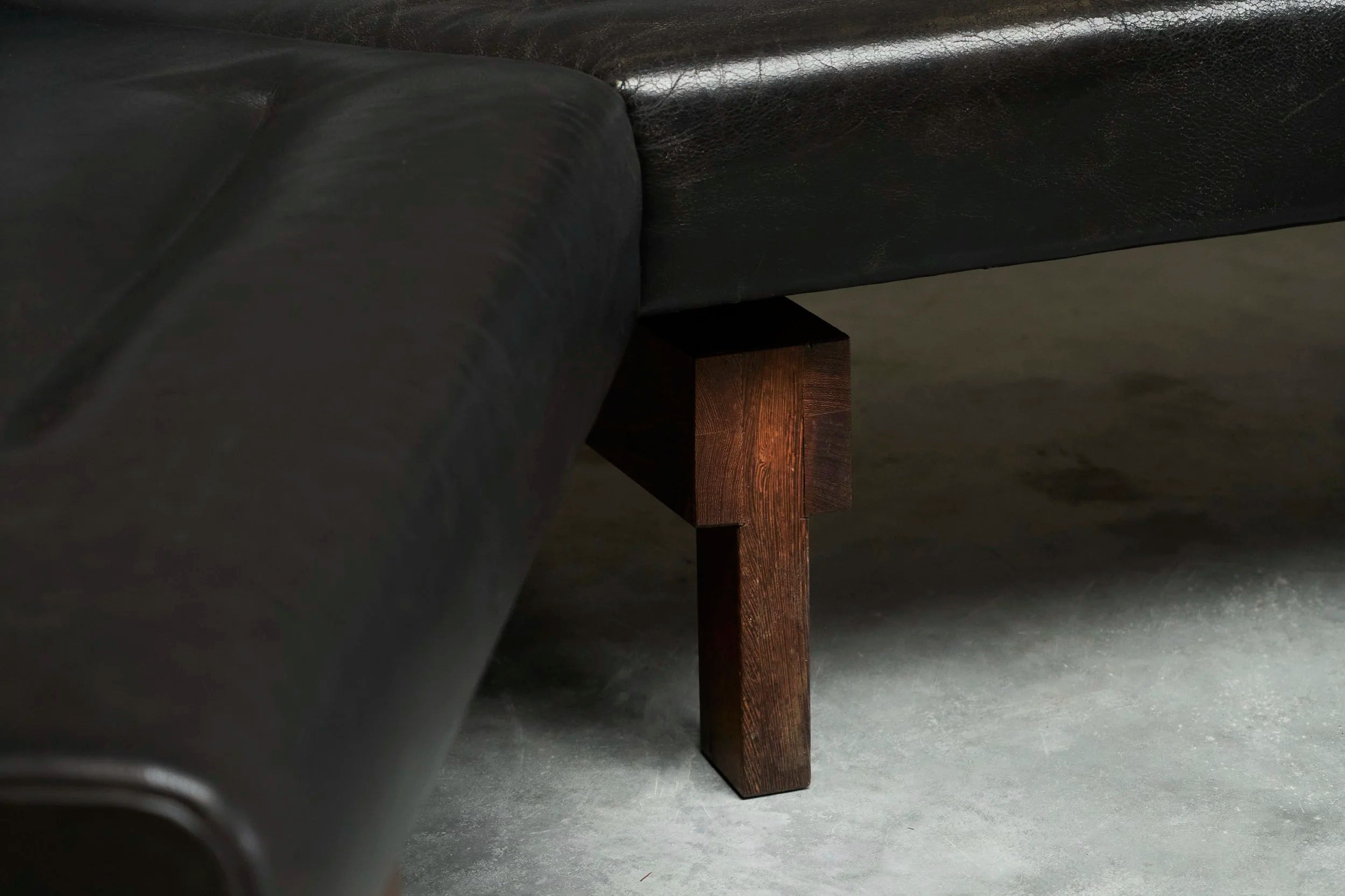 Martin Visser One-Off Boomerang Sofa in Solid Wengé and Black Leather — lifestyle setting