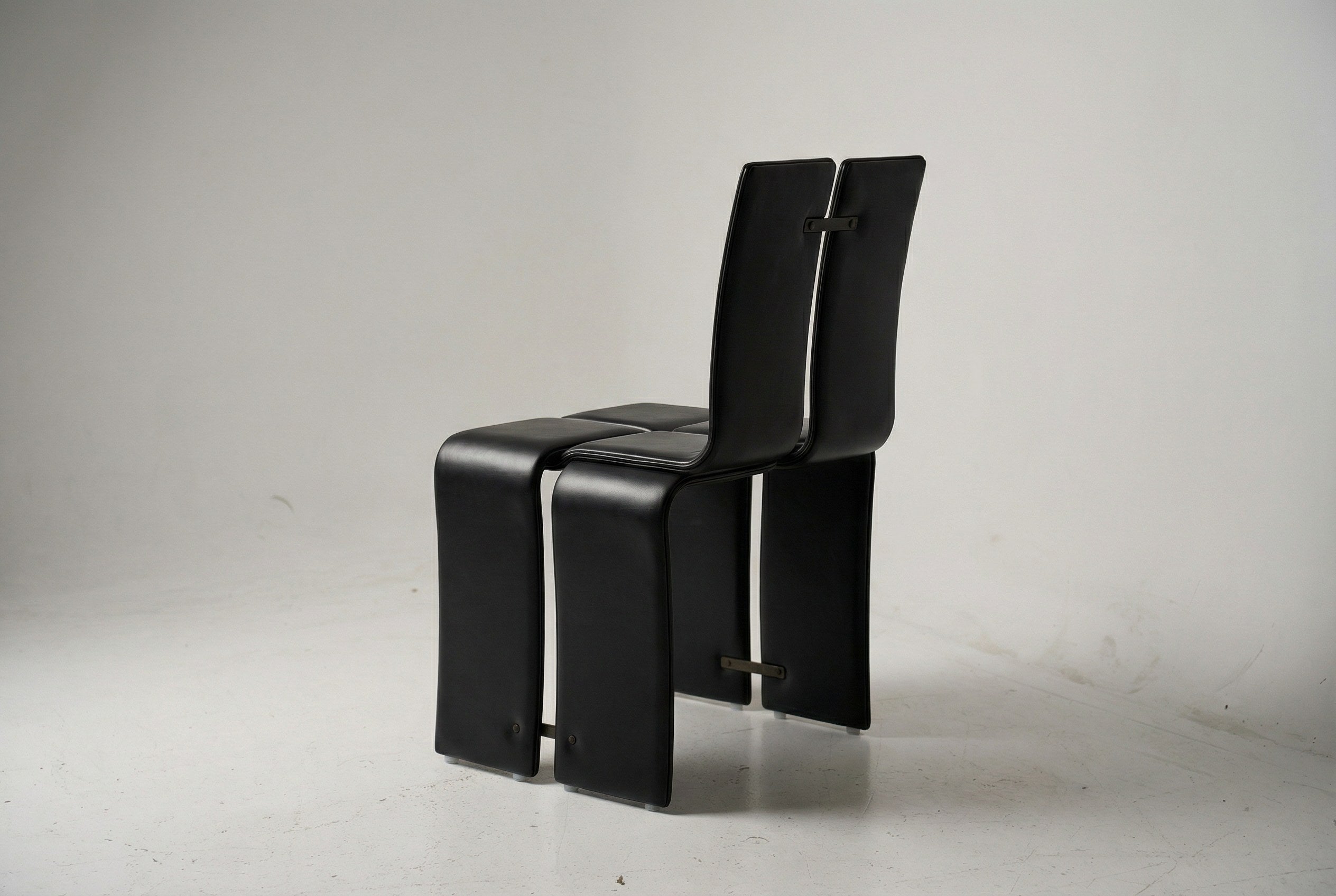 Weaving Chair - Leather — side view highlighting black leather and metal details