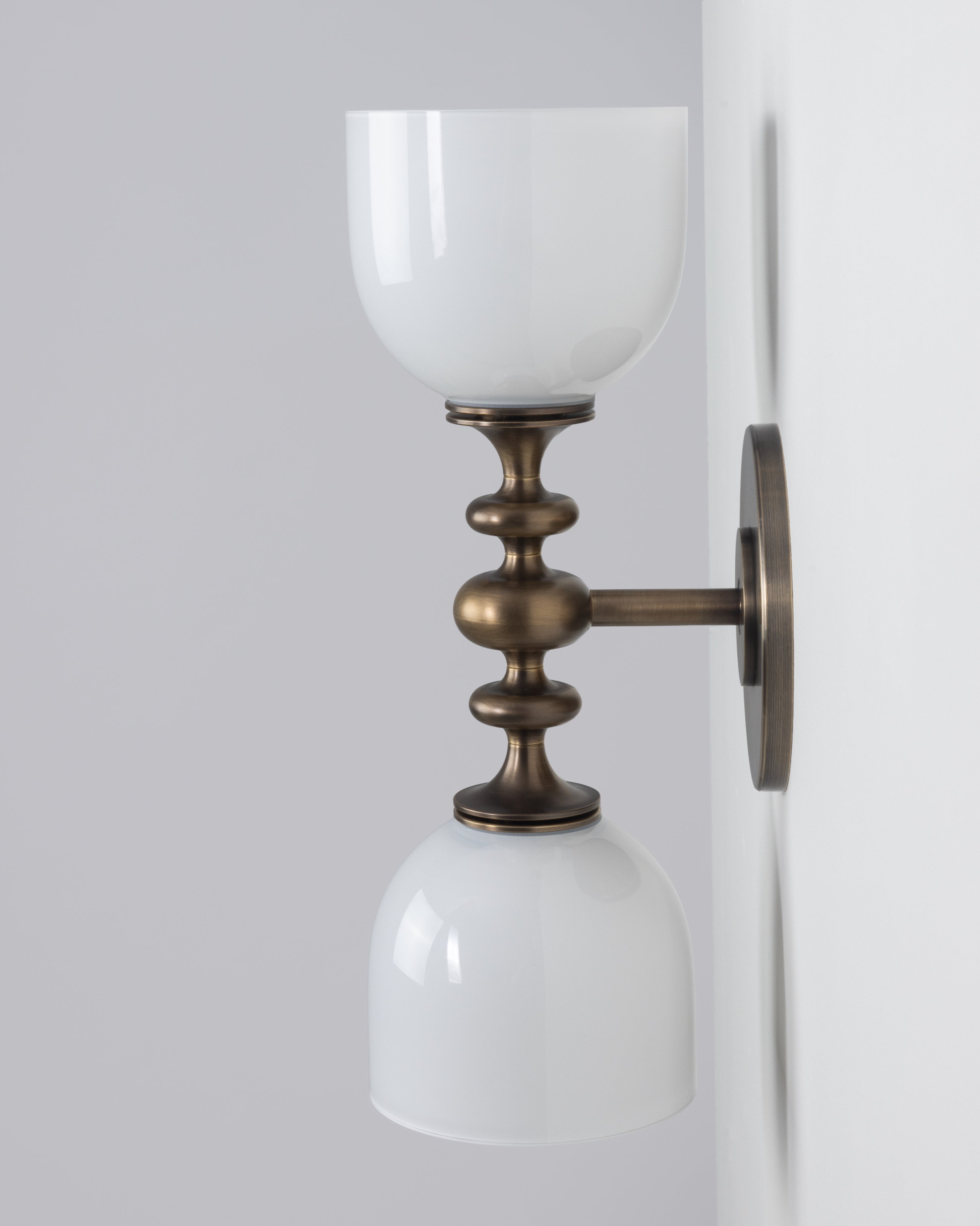SkLO + AvroKO Marchesa Sconce - White glass, Antique Brass finish — side angle