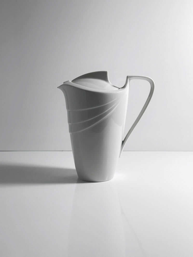 White porcelain Art Deco pitcher with curved lines and elegant spout