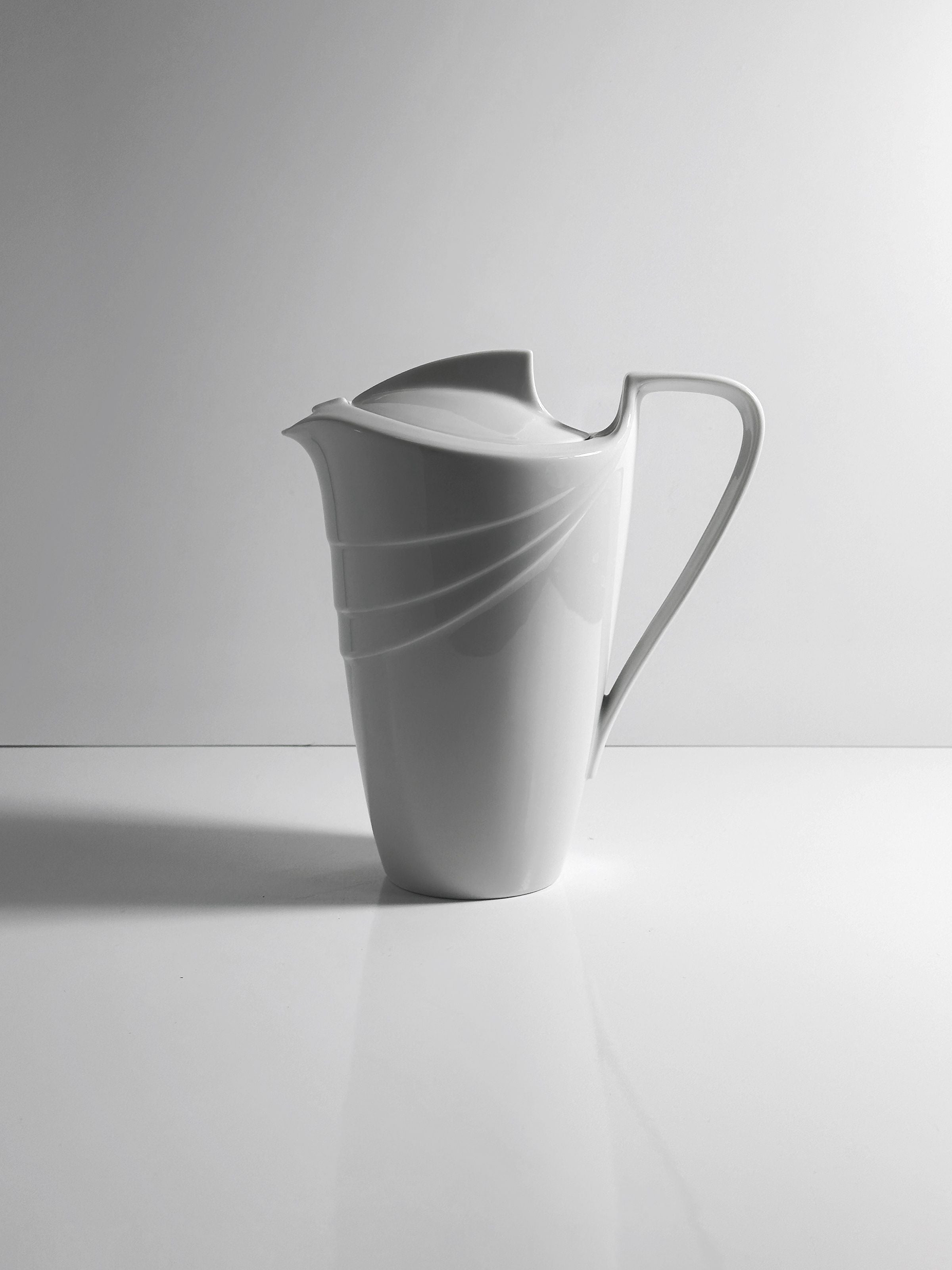 White porcelain Art Deco pitcher with curved lines and elegant spout