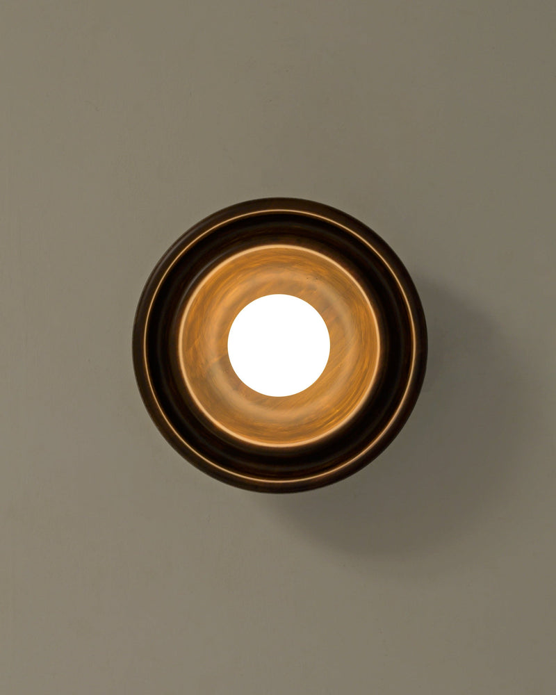 Discus XS Wall Light — top view of circular brass fixture