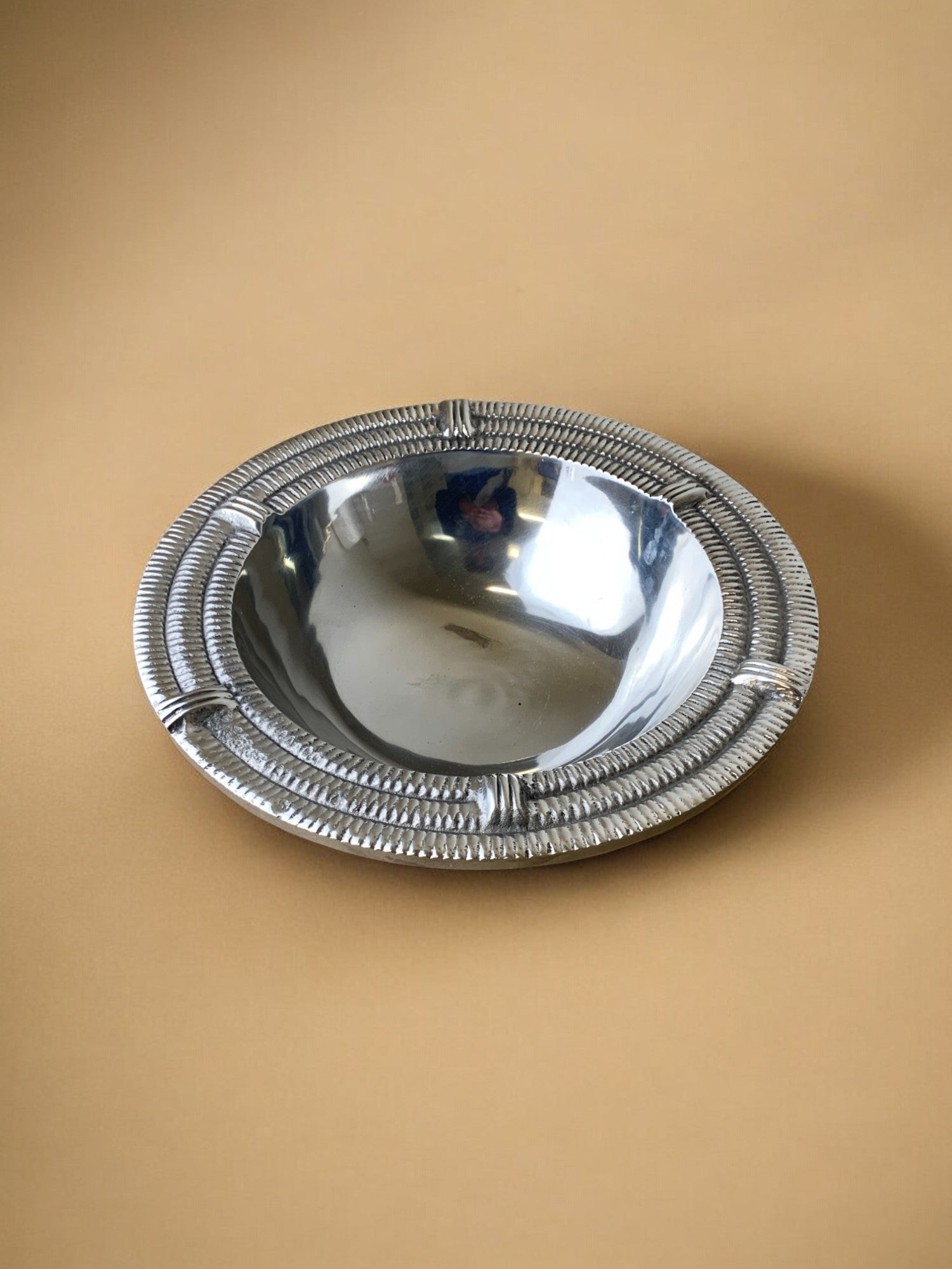 Ridged Circular tray, solid aluminium, Spain, 1980's — close-up of reflective surface detail