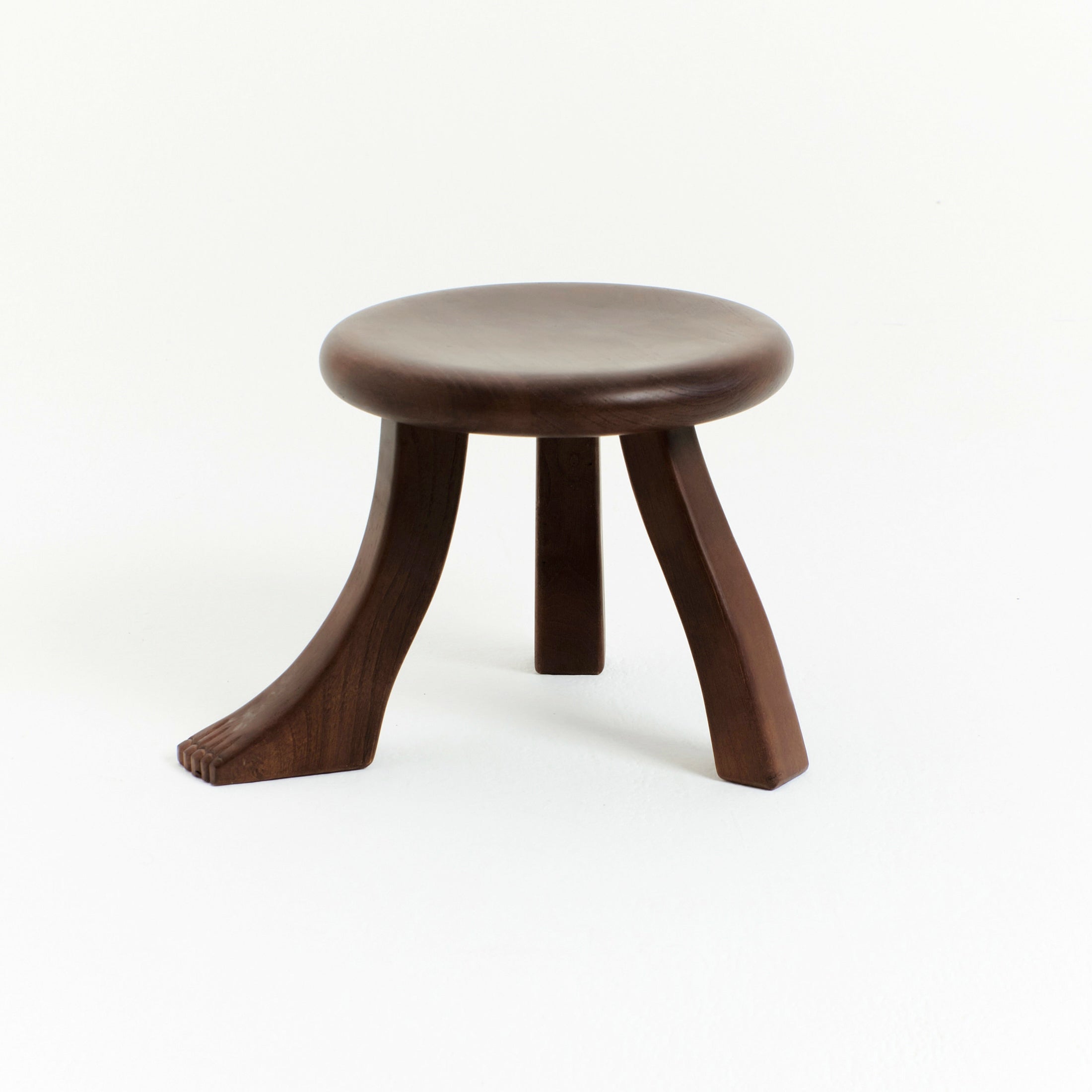 Foot Stool in Black Chestnut — angled view highlighting wooden legs