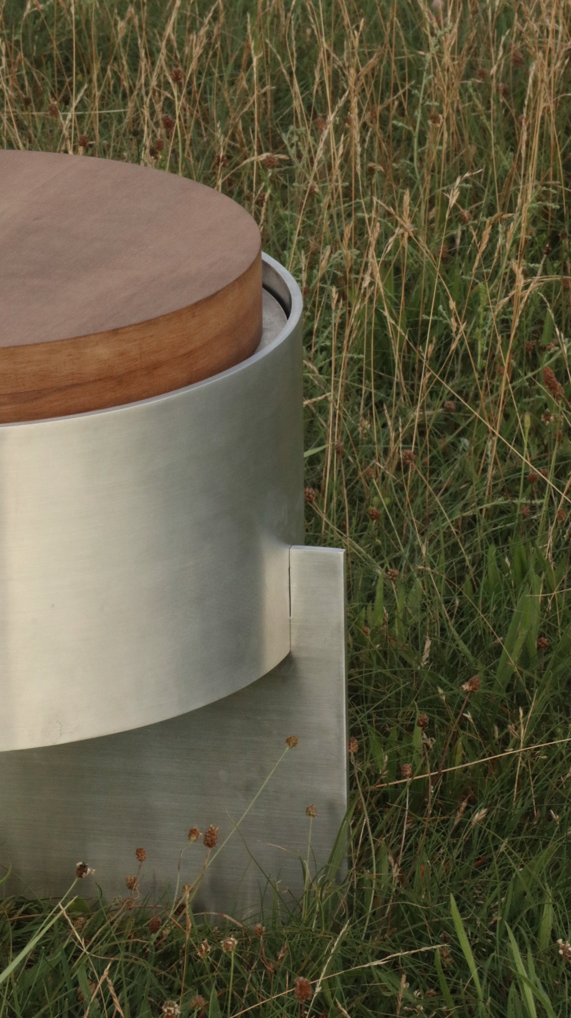 Lunar Side Table — close-up of brushed metal and wood surface