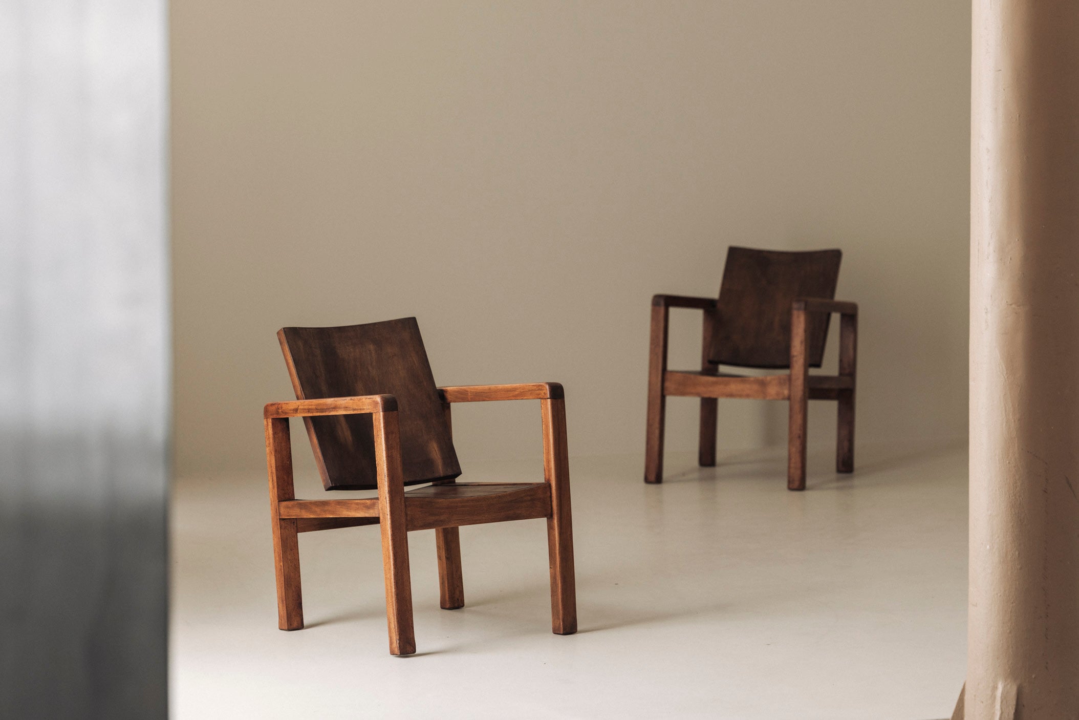 Pair of French Modernist Mahogany Armchairs, 1950s — lifestyle setting