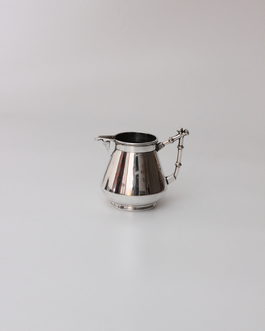 Art Deco Coffee Set — side angle of polished silver coffee pot