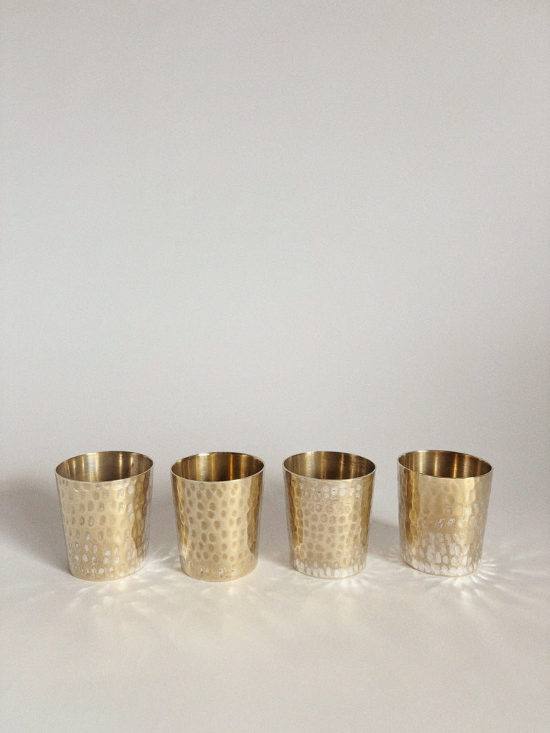 Four Huerto 4 Silver Plated Cups are arranged in a row on a plain white background, casting soft shadows beneath them.