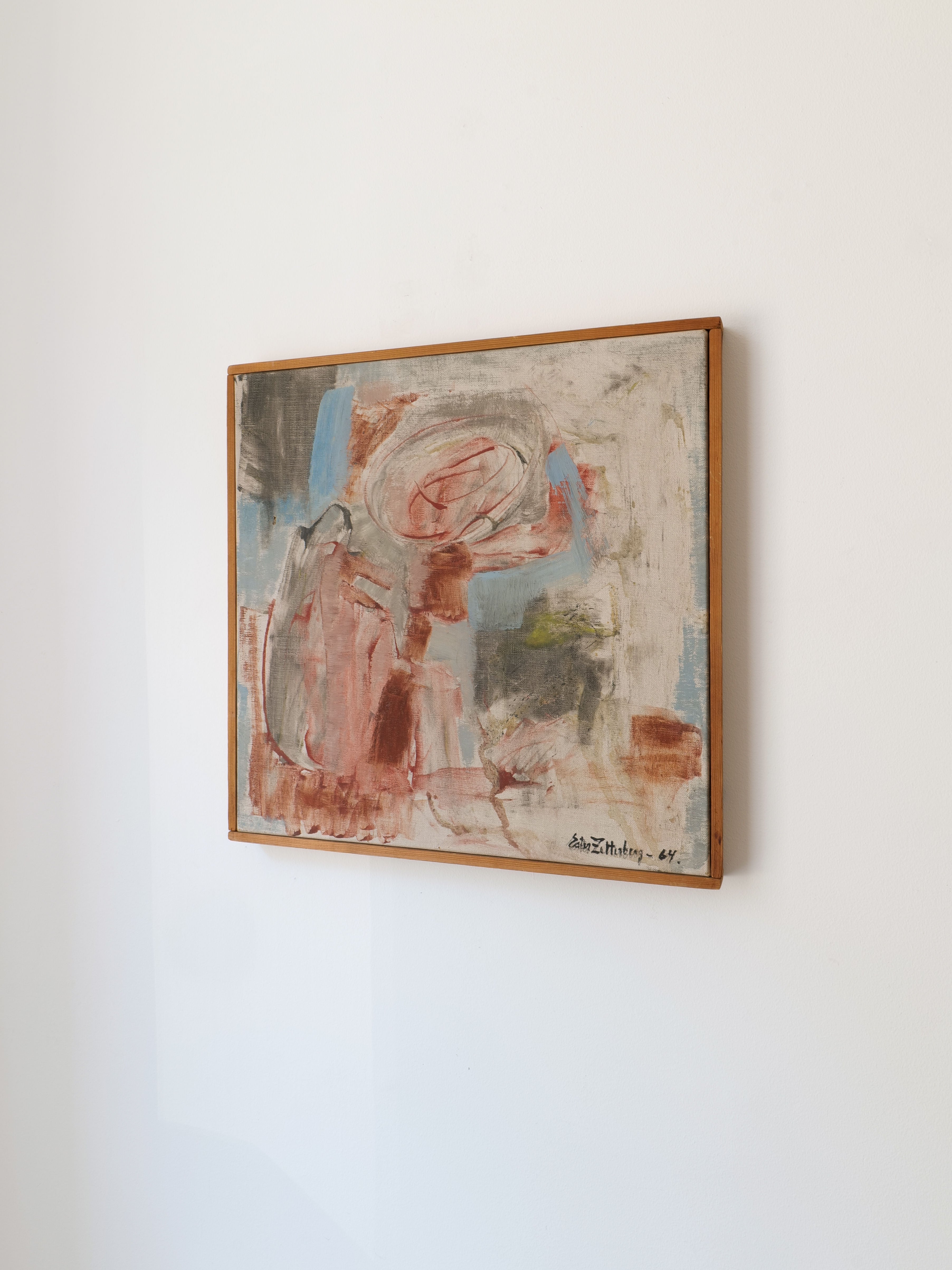 The 'Summer' painting by Swedish artist Ester Zetterberg from the 1960s, part of the Collection apart brand, hangs on a white wall. It showcases abstract brushstrokes with soft blends of red, blue, gray, and beige tones in a chaotic layered composition.