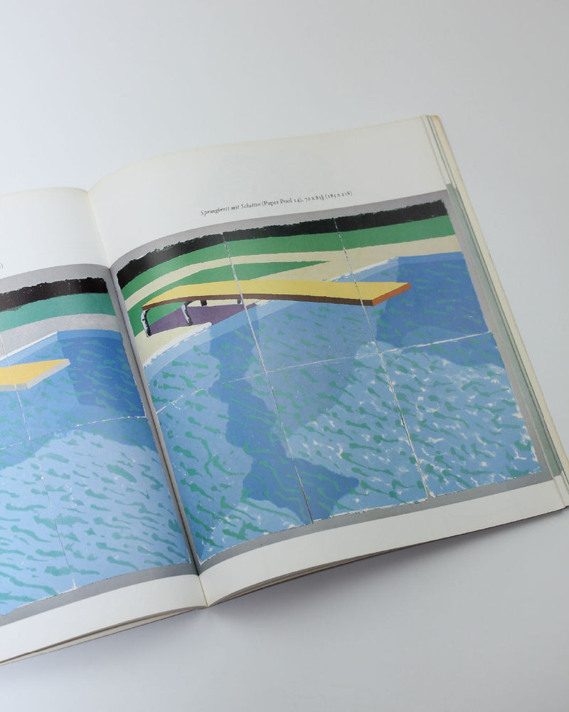 Open David Hockney Paper Pools art book showing swimming pool illustration