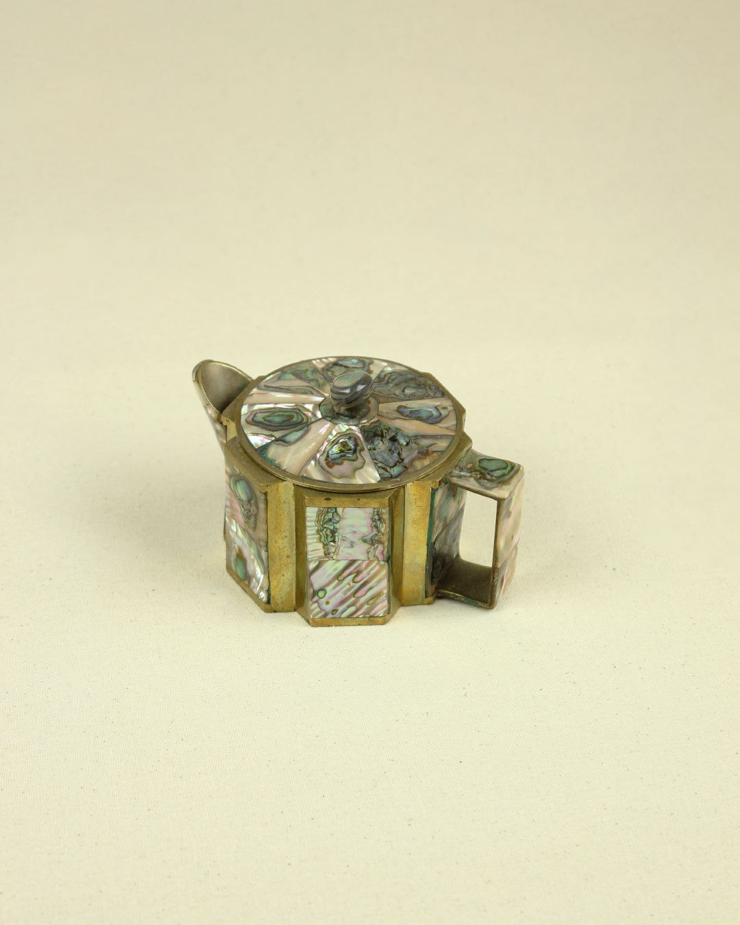 Abalone shell and brass small Mexican jug detail view