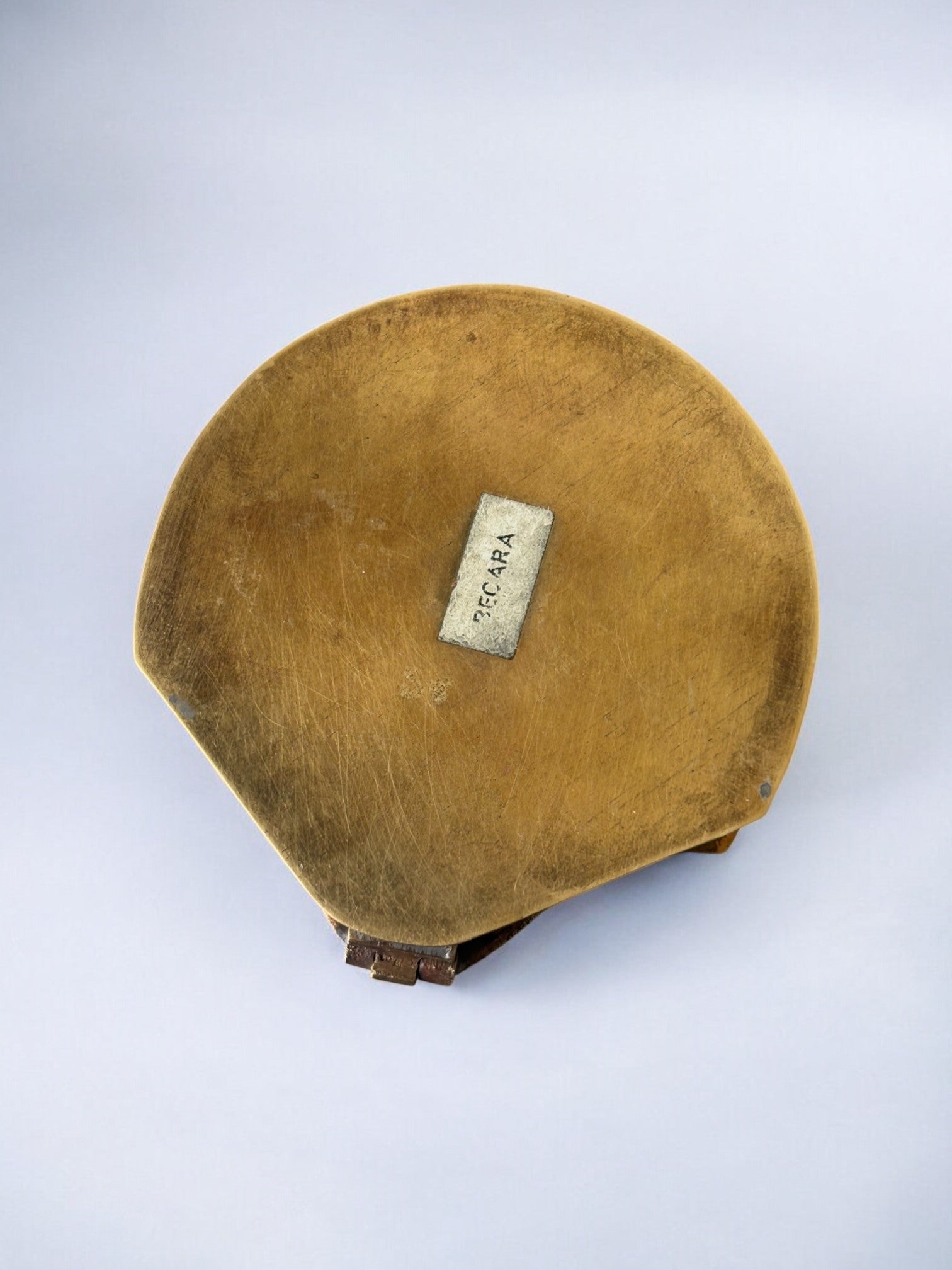 Interior view of vintage brass shell jewelry box with label