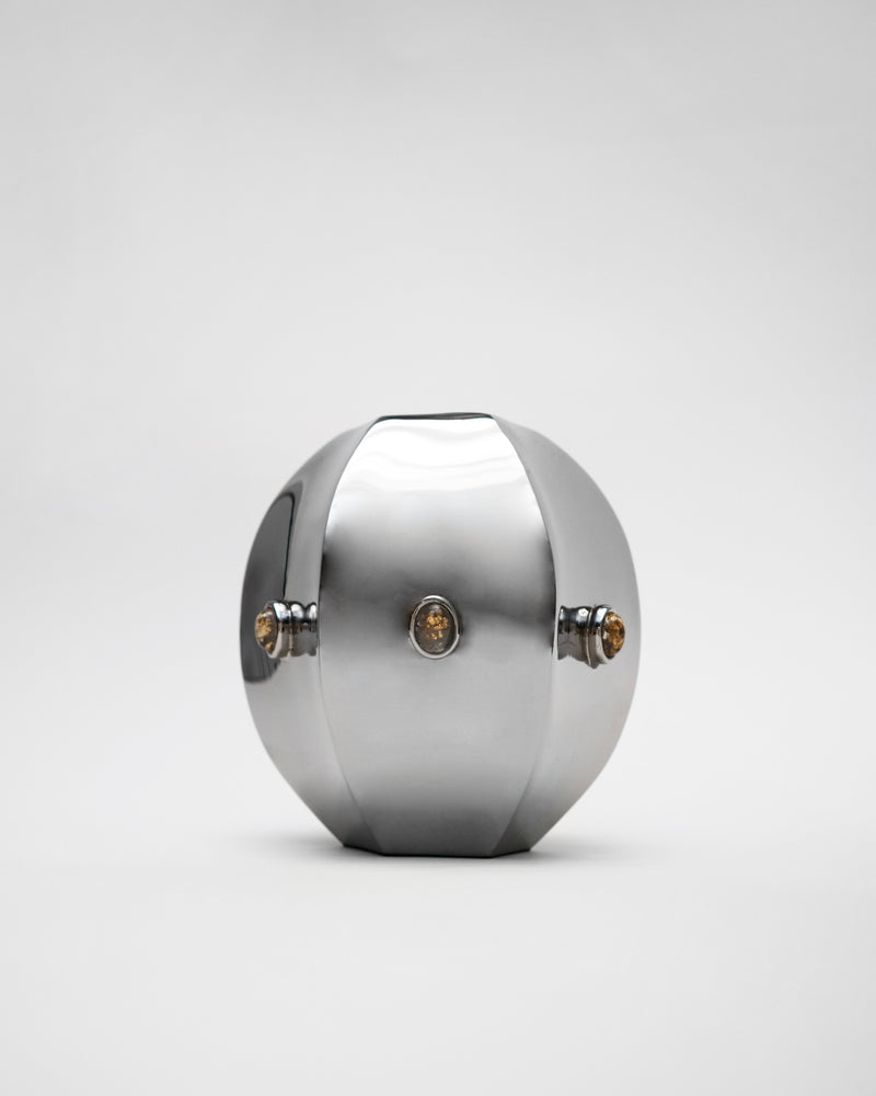 Polished titanium Evi vase with geometric faceted design by Hein Studio