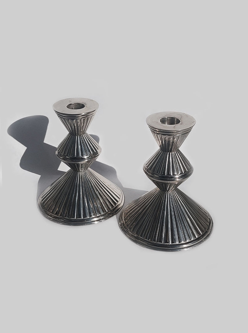  Pair of elegant candle stands with leaf pattern and rustic charm