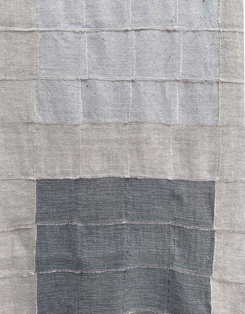 Blue Sky" Artwork by Sundance Studio features a grid pattern with three shades of gray—light at the top, medium center, dark bottom. Its wool-cotton blend showcases visible stitching along the grid for added texture.