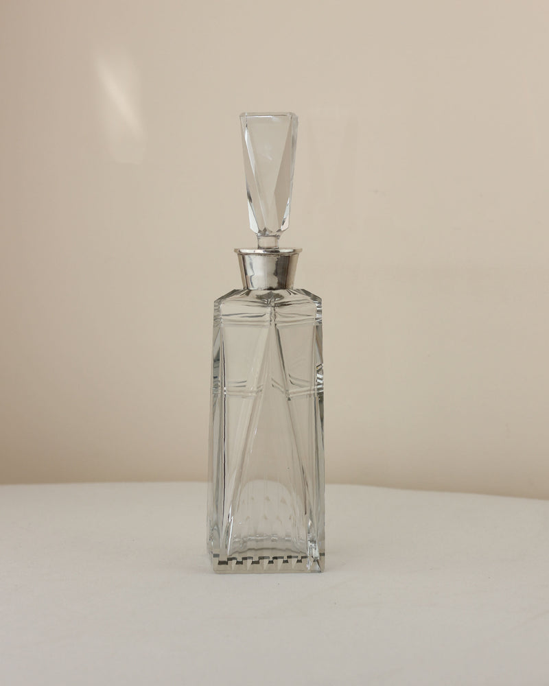 Art Deco crystal decanter front view with geometric stopper