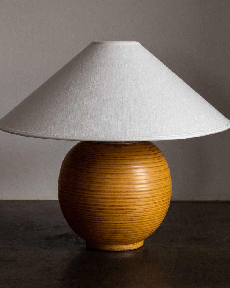Swedish ceramic table lamp with ribbed amber base and conical shade