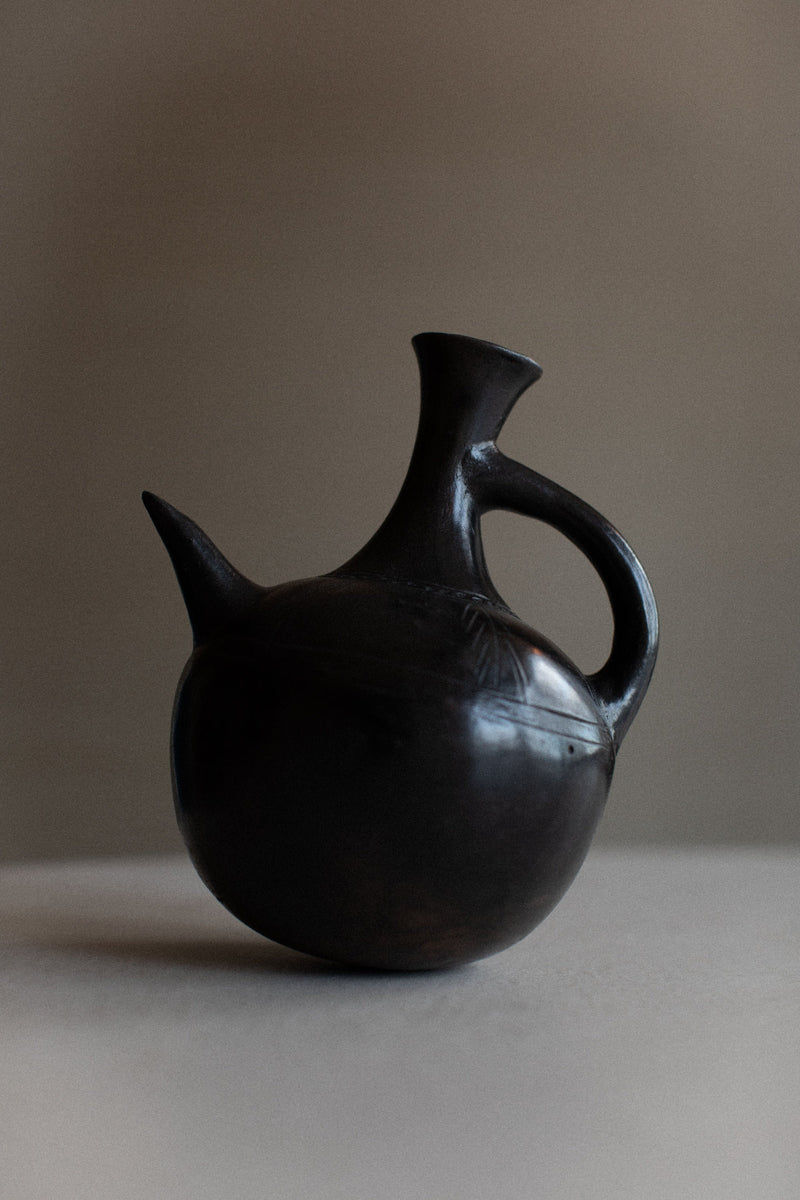 Ethiopian Teapot made of handcrafted clay with intricate patterns