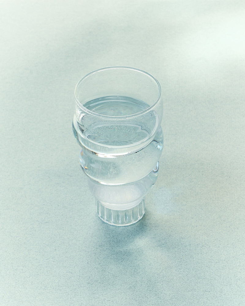 Paguro transparent glass water tumbler with ribbed base design