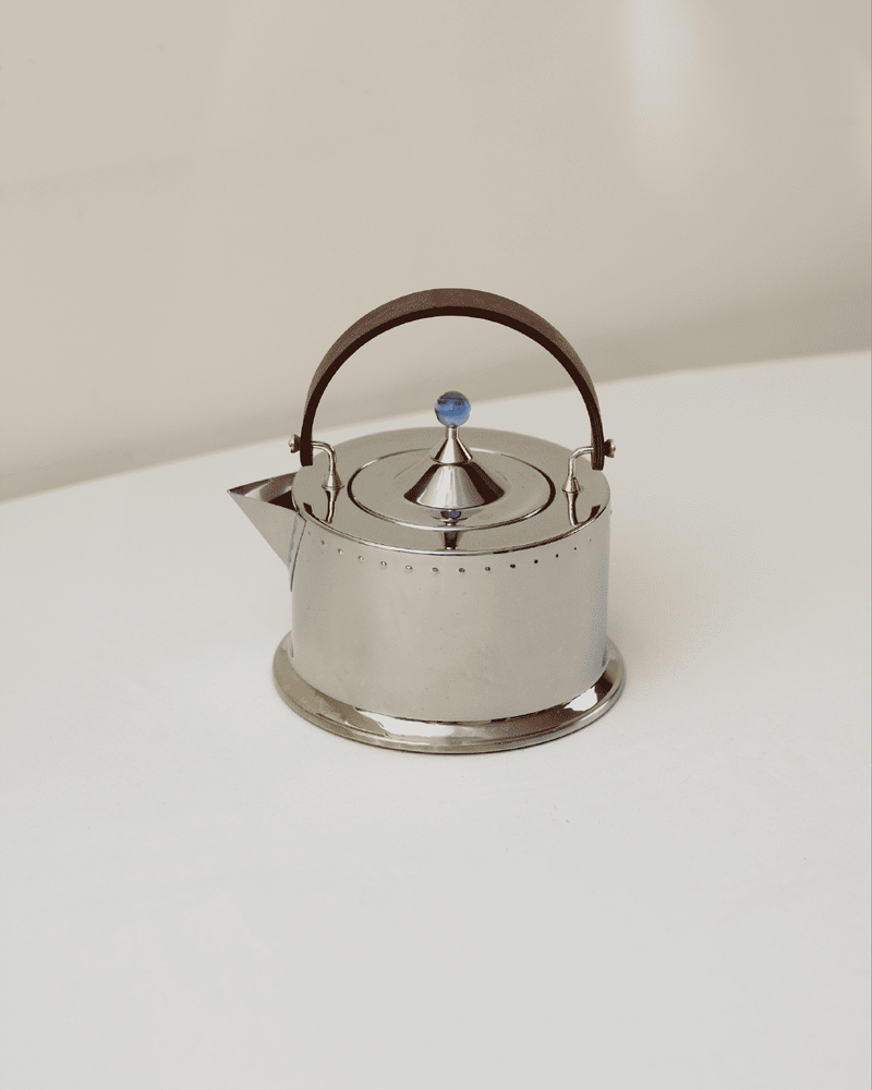 Modern silver teapot with leather handle by Carsten Jorgensen