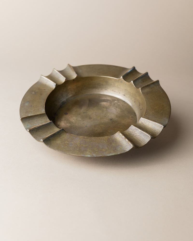Brutalist brass ashtray with geometric notched rim, Italy 1940s