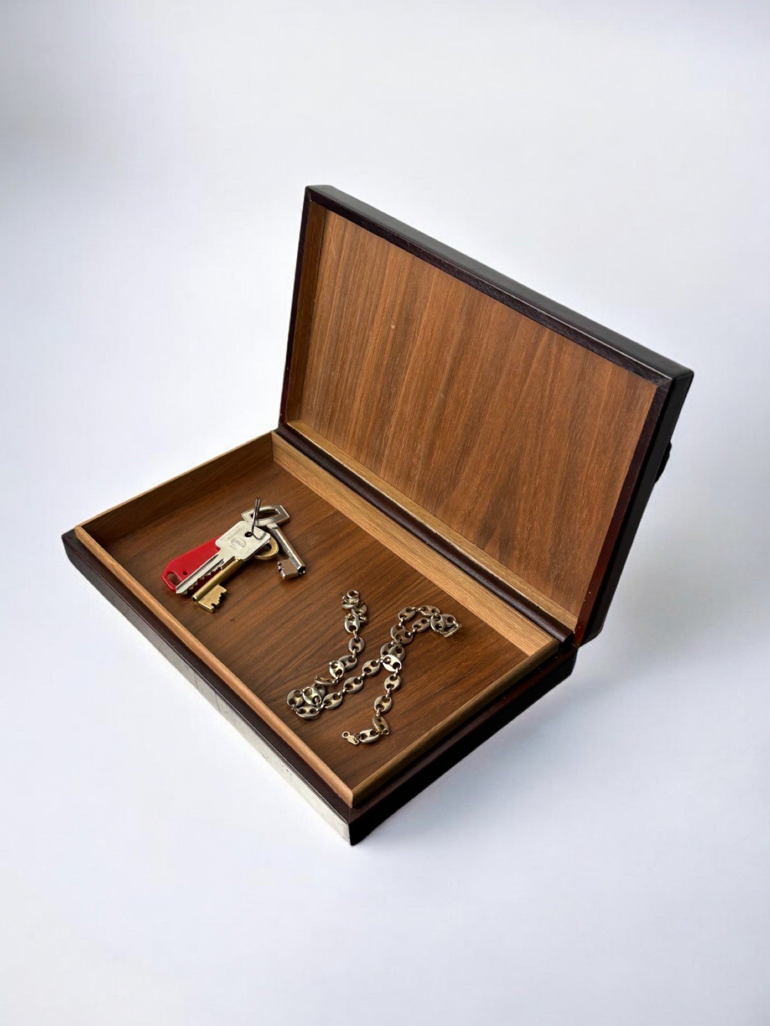 Loewe wooden box interior with gold keys and chain detail