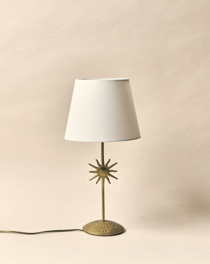 Ischia brass table lamp with sun motif and white shade by SÒLER
