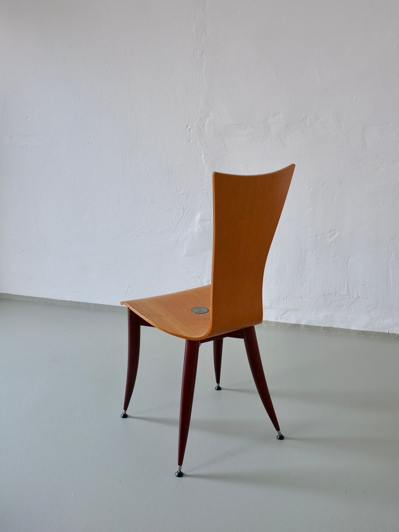 Italian plywood chair with burgundy wooden legs, profile view