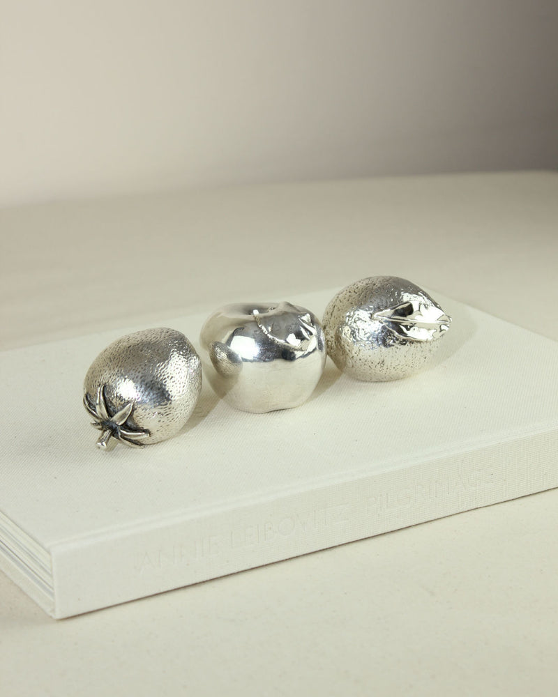 Three 925 silver-plated fruit figurines on marble display base