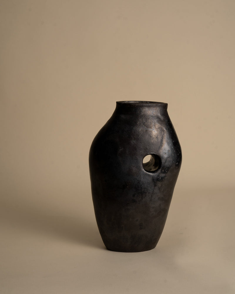 Black ceramic vase with circular opening from Tunnel Series
