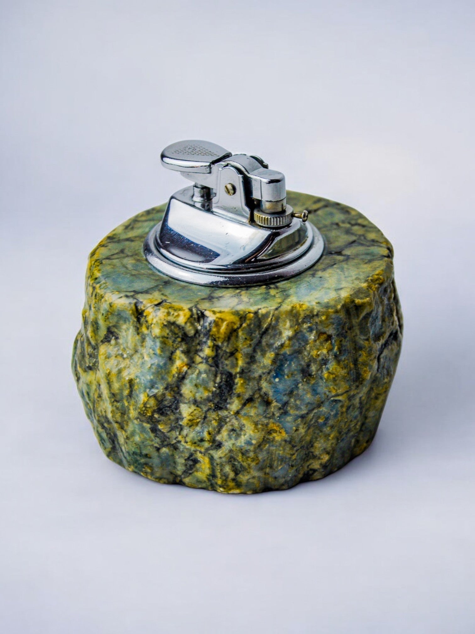 Green alabaster table lighter with chrome mechanism detail view