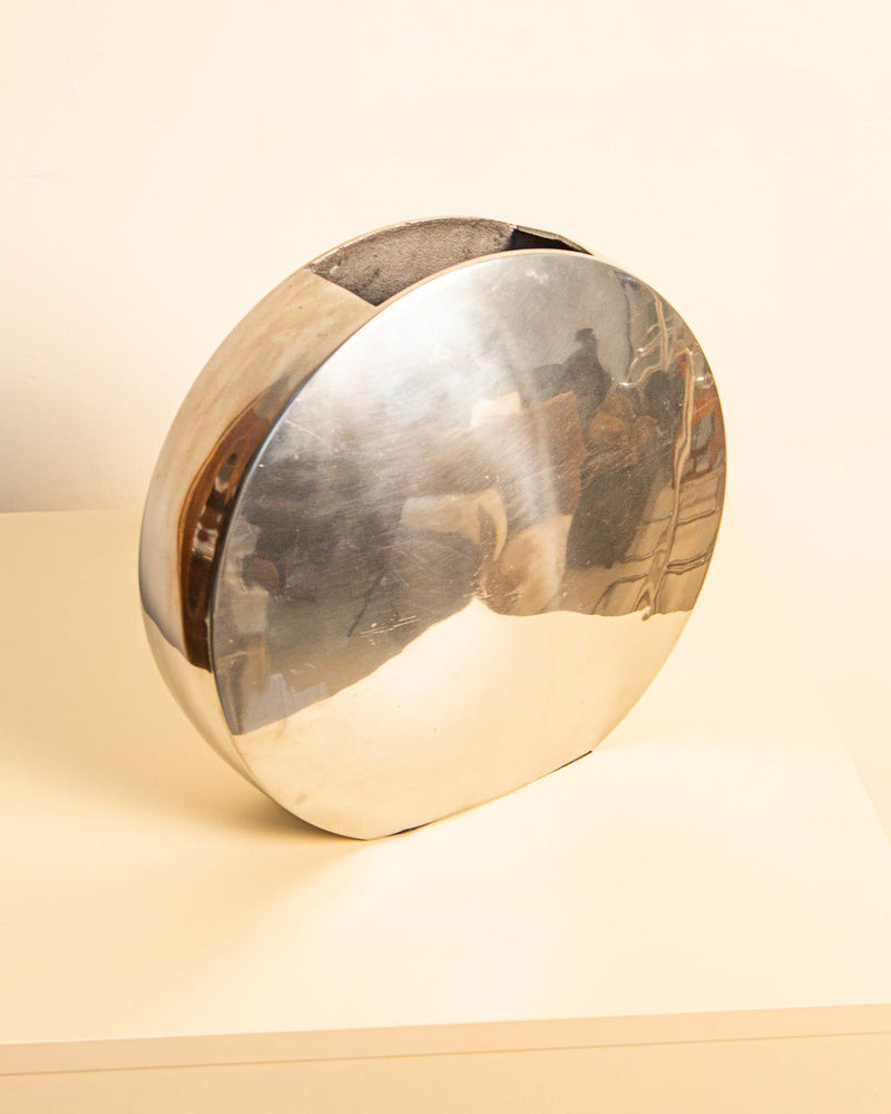 Circular cast-aluminum vase with reflective finish, Italian 1980s