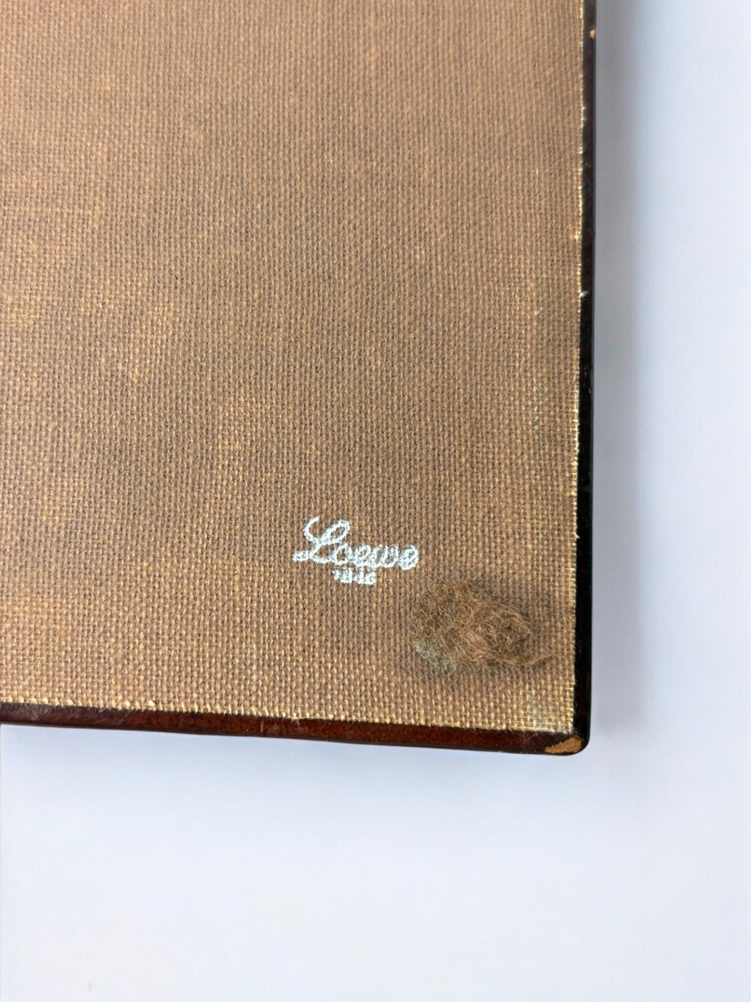 Loewe signature detail on beige leather box corner