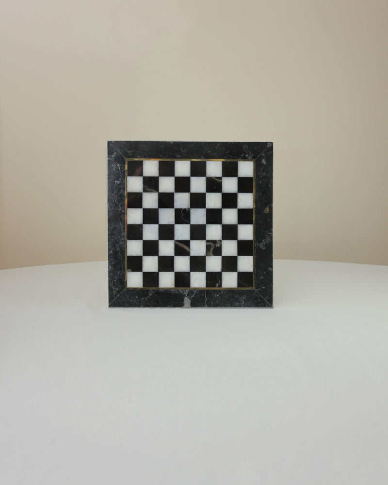 Black and white marble chessboard with dark veined border frame