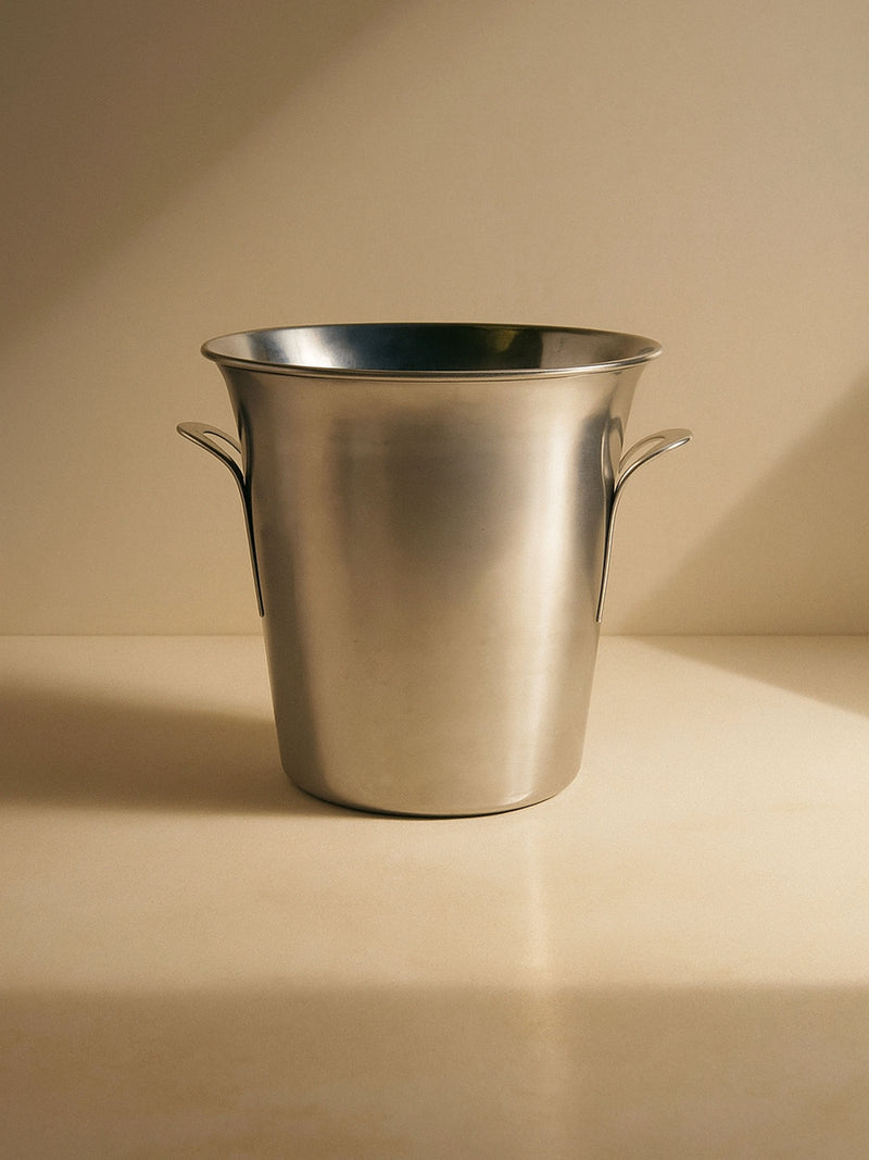 Polished stainless steel champagne ice bucket with curved handles