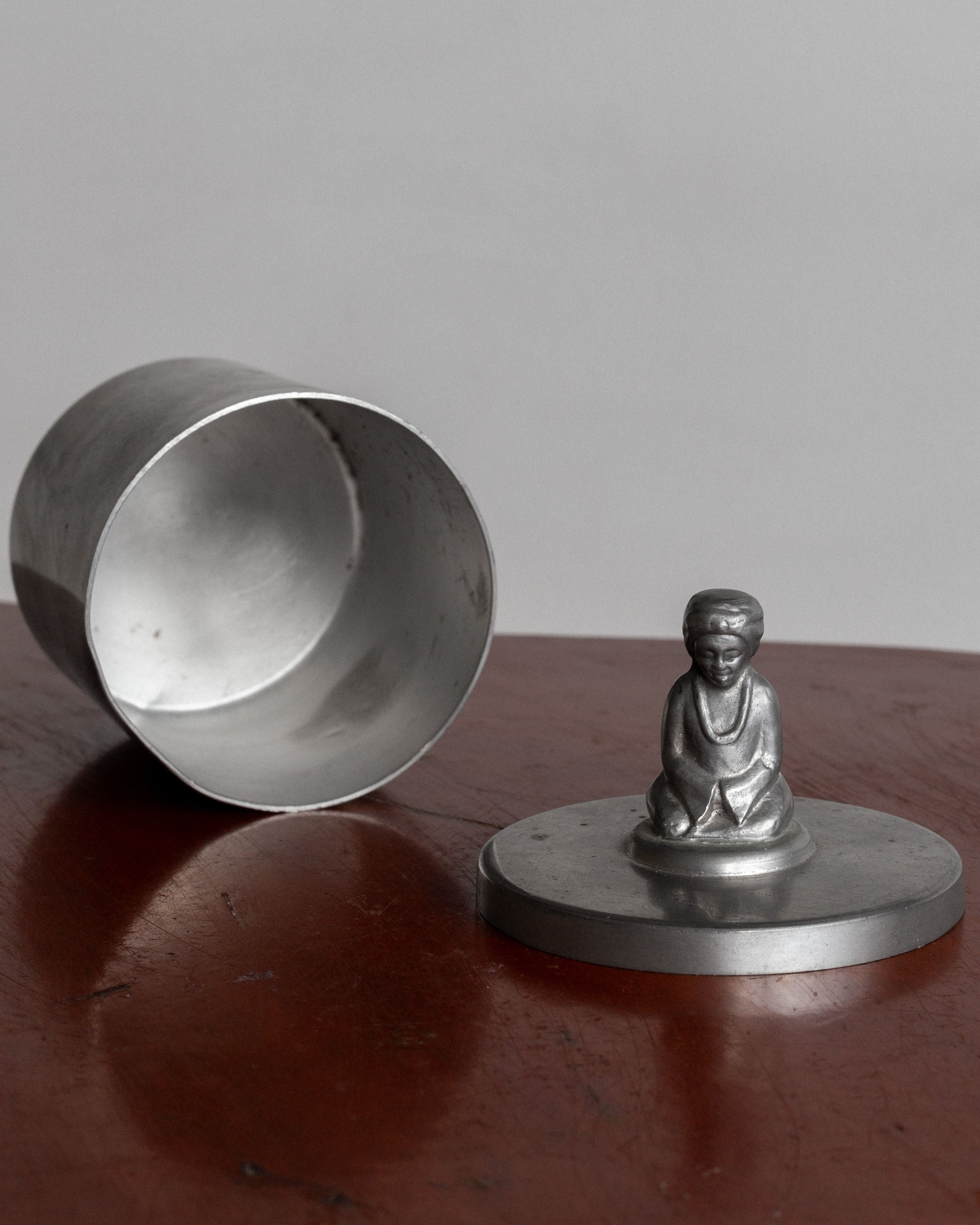 Art Deco pewter box open showing Buddha figurine lid detail