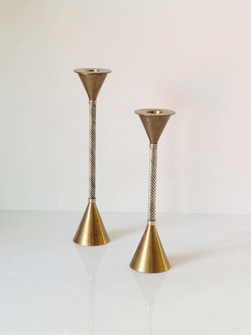 Twisted brass candlesticks with conical tops and bases detail