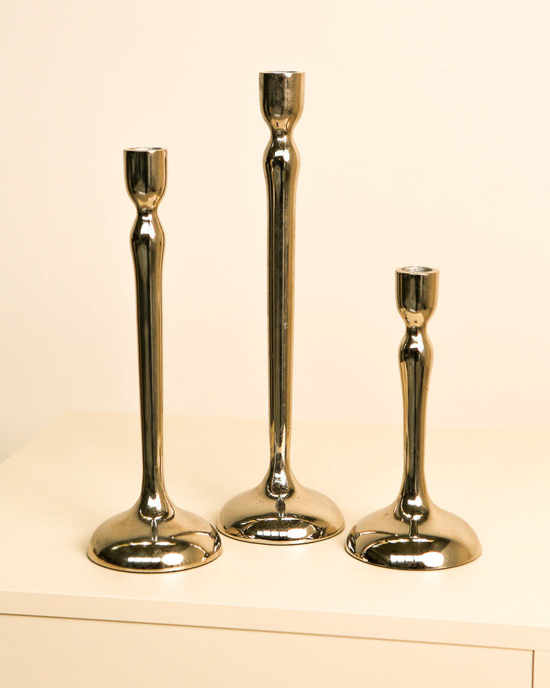 Set of three brass Italian taper candlesticks in graduated heights