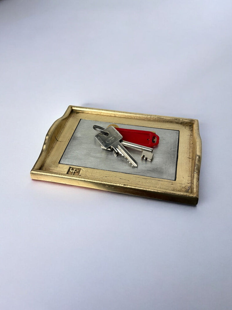 Brutalist brass and steel vide-poches with keys detail view