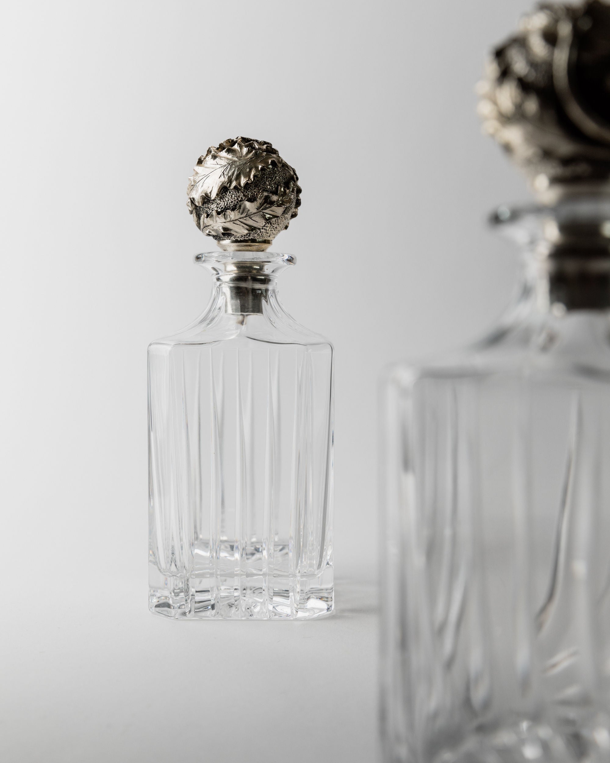 Italian crystal decanter with ornate silver stopper detail
