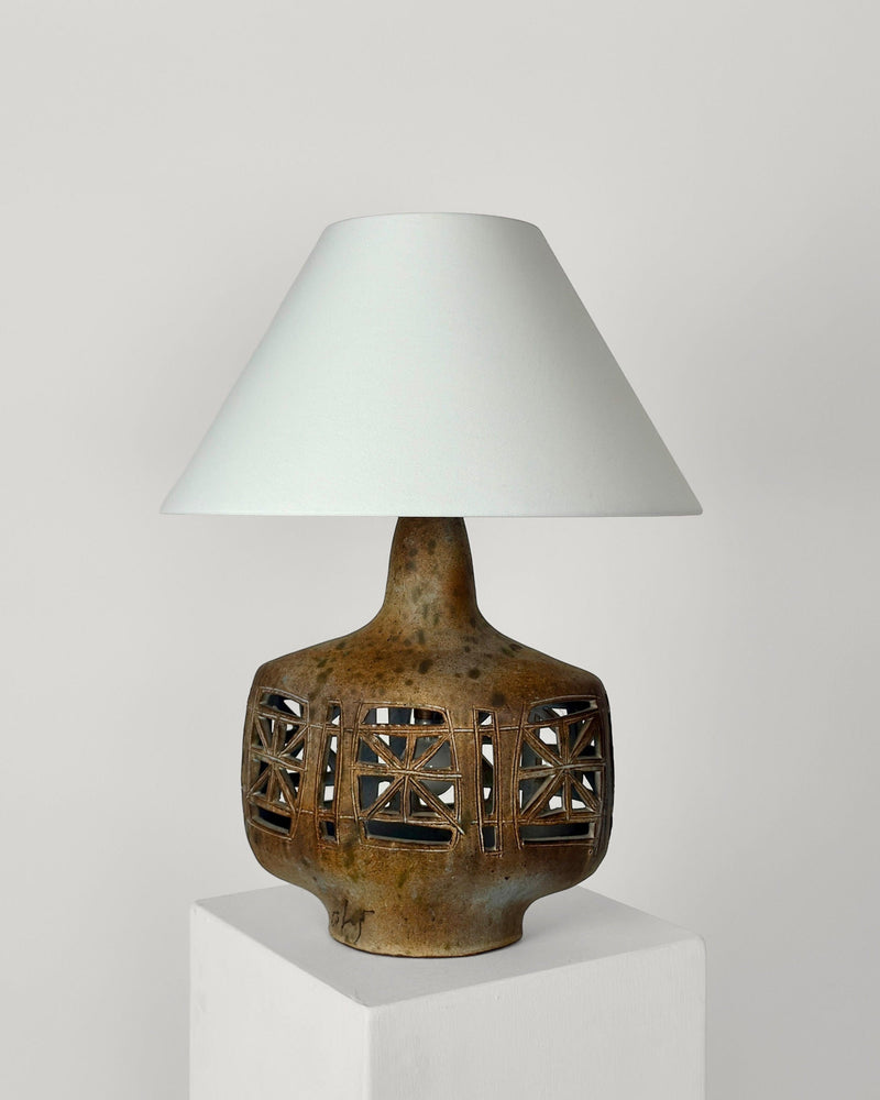 Geometric ceramic table lamp with cutout pattern by Agnes Escala
